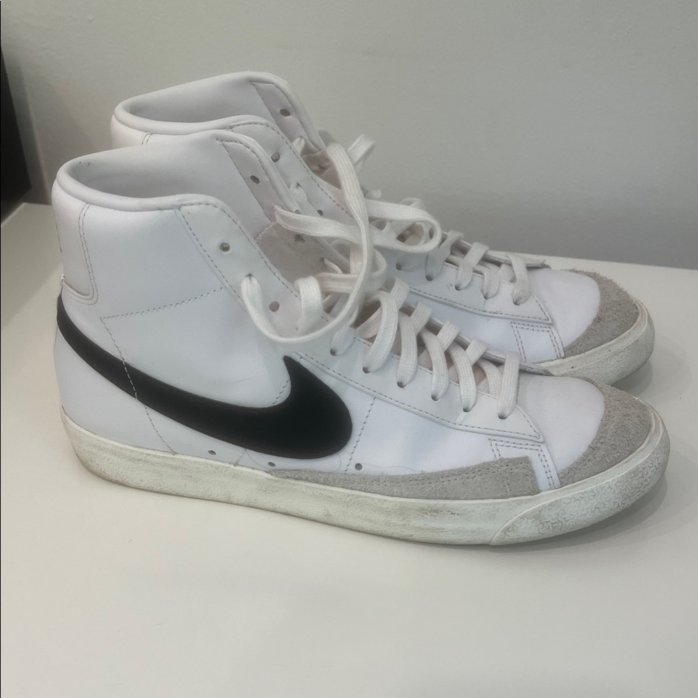 Nike White High-Top Sneakers with Black Swoosh